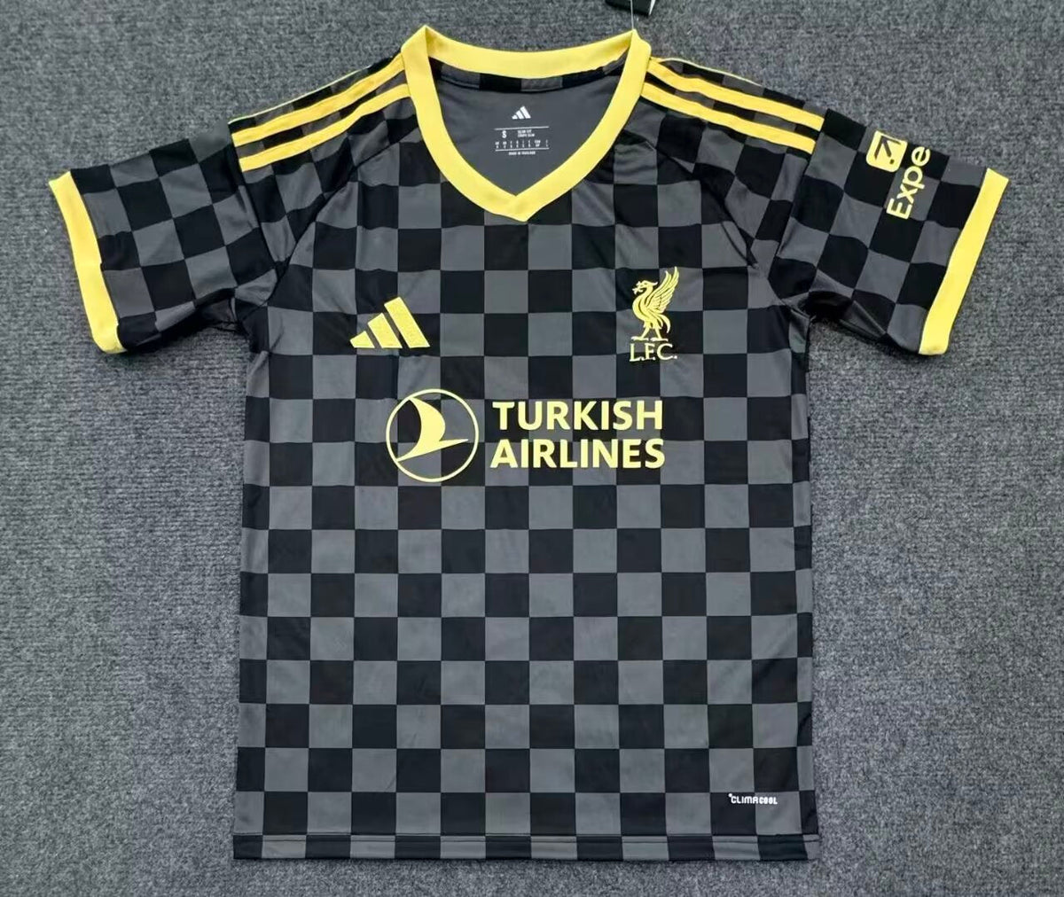 27/28 Liverpool away fan jersey front view in black and yellow