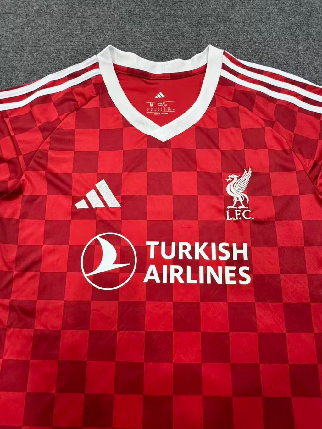27/28 Liverpool home fan jersey crest and collar detail