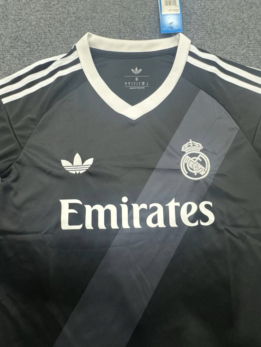 27/28 Real Madrid away fan jersey crest and collar detail