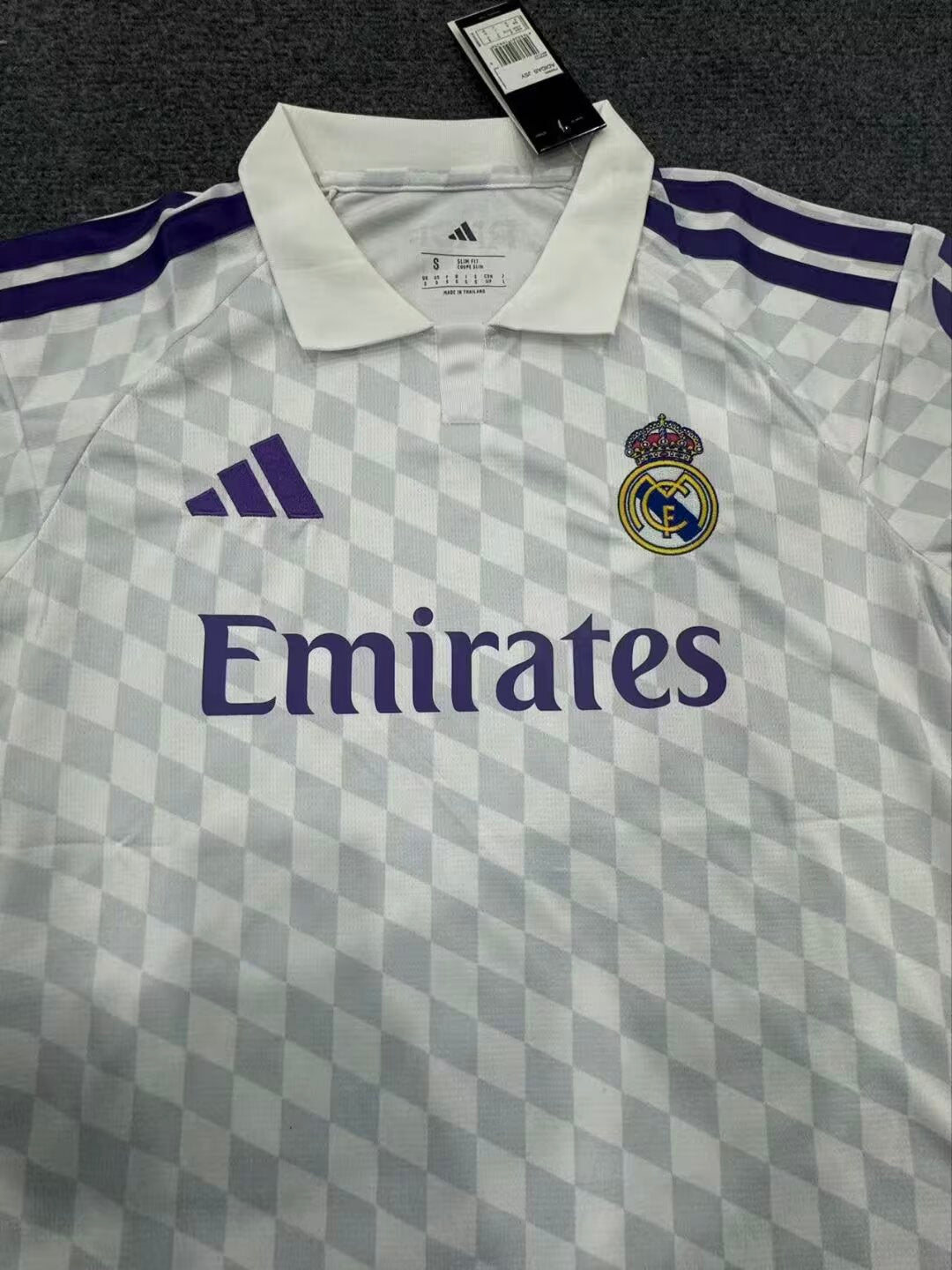 27/28 Real Madrid home fan jersey crest and collar detail